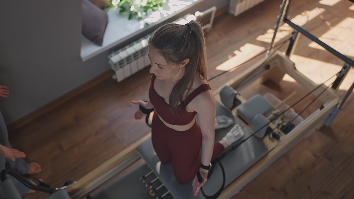 Load video: Strap work on a wood-frame reformer at home